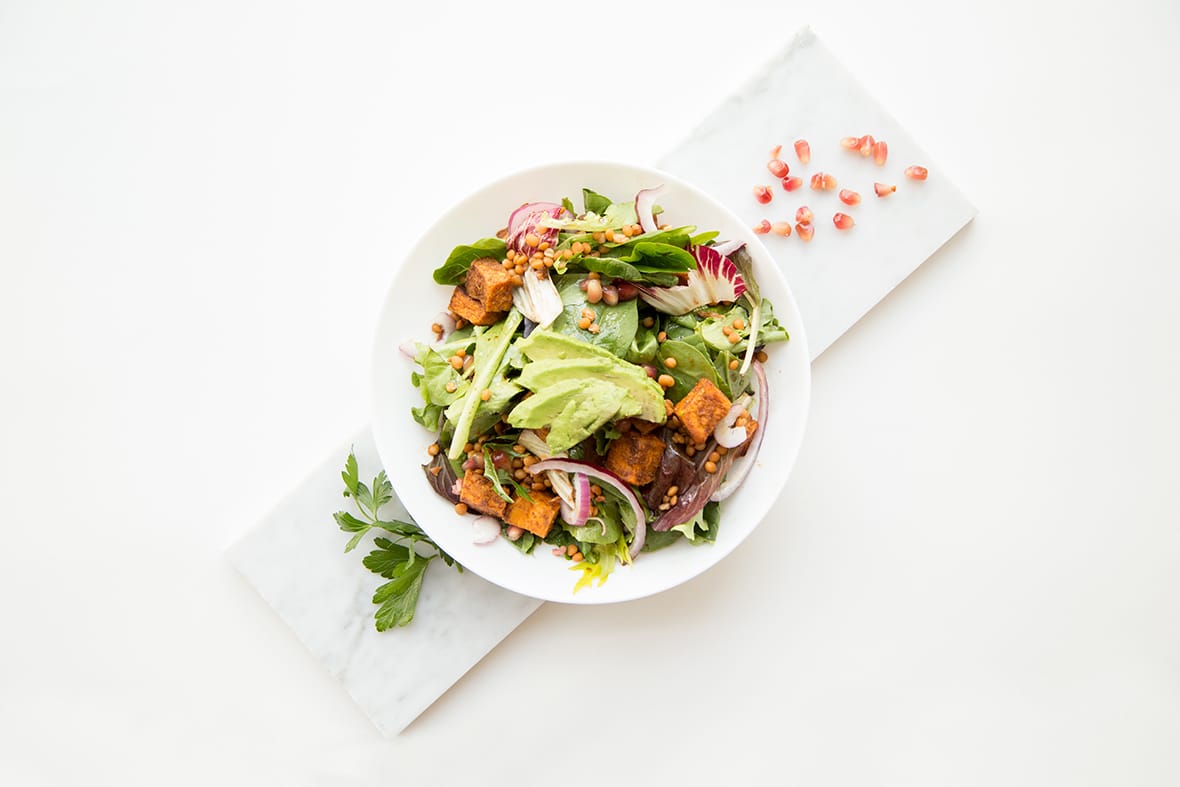 Salad with tofu and avocado in a bowl